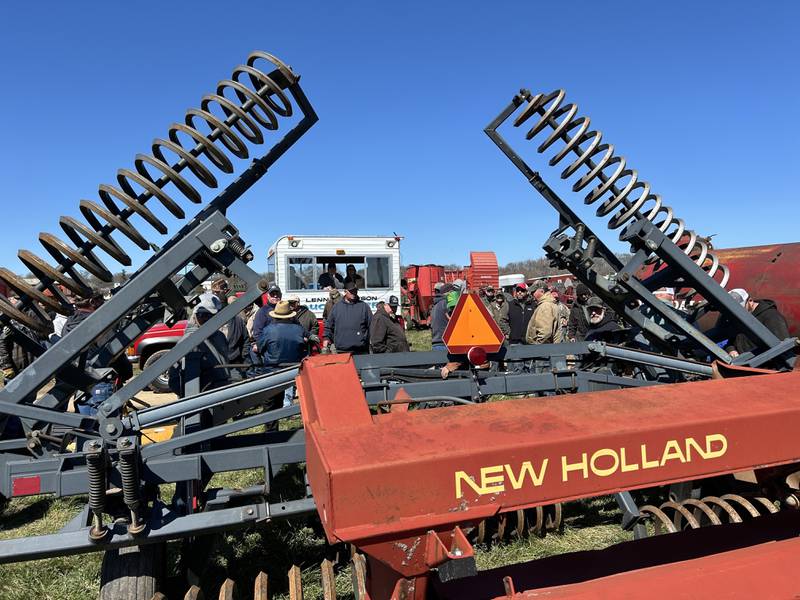 One of four auctioneer wagons makes its way down a row of farm machinery at the Hazelhurst Annual Spring Consignment Auction Saturday, April 6, 2024. The annual event is held each year on a farm along Milledgeville Road, between Polo and Milledgeville.