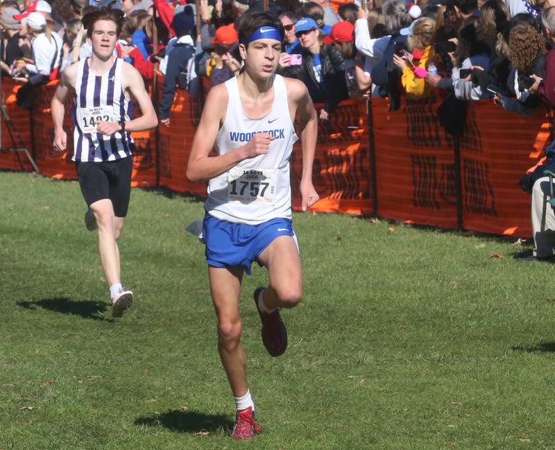 Dixon's Keegan Shirley and Woodstock's Milo McLeer compete in the Class 2A State Cross Country race on Saturday, Nov. 4, 2023 at Detweiller Park in Peoria.