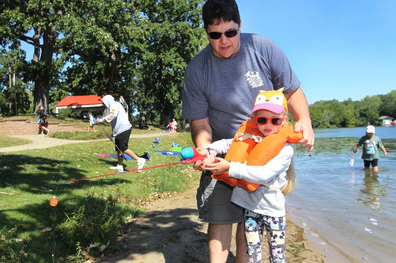 Brian Neff, of Round Lake helps his daughter, Brynlee 6, cast her line to fish in Round Lake during the Family Fishing Event at Lake Front Park on Saturday, September 9th in Round Lake Beach. The event was sponsored by the Round Lake Area Park District and the Huebner Fishery Management Foundation.
Photo by Candace H. Johnson for Shaw Local News Network