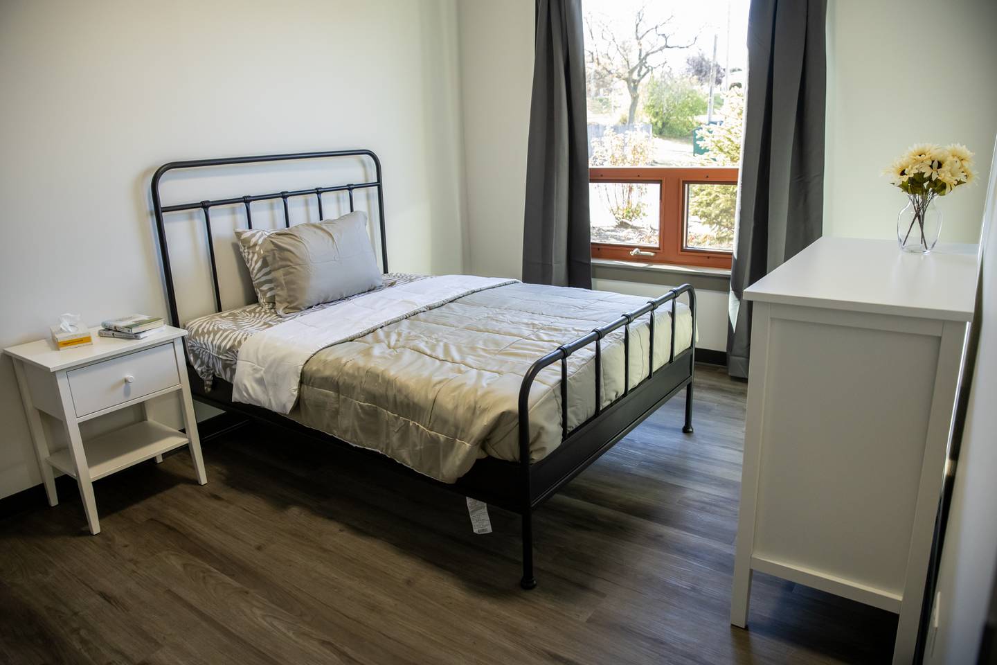 A room for a mother includes a bed, dresser and more in a furnished apartment at Stepping Stones’ new Women and Children Recovery Home on Oct. 30, 2025.