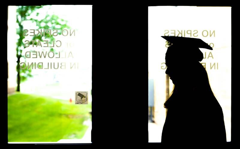 A graduate is silhouetted in the door after the 2024 Sycamore High School commencement in Sycamore on Sunday, May 26, 2024.