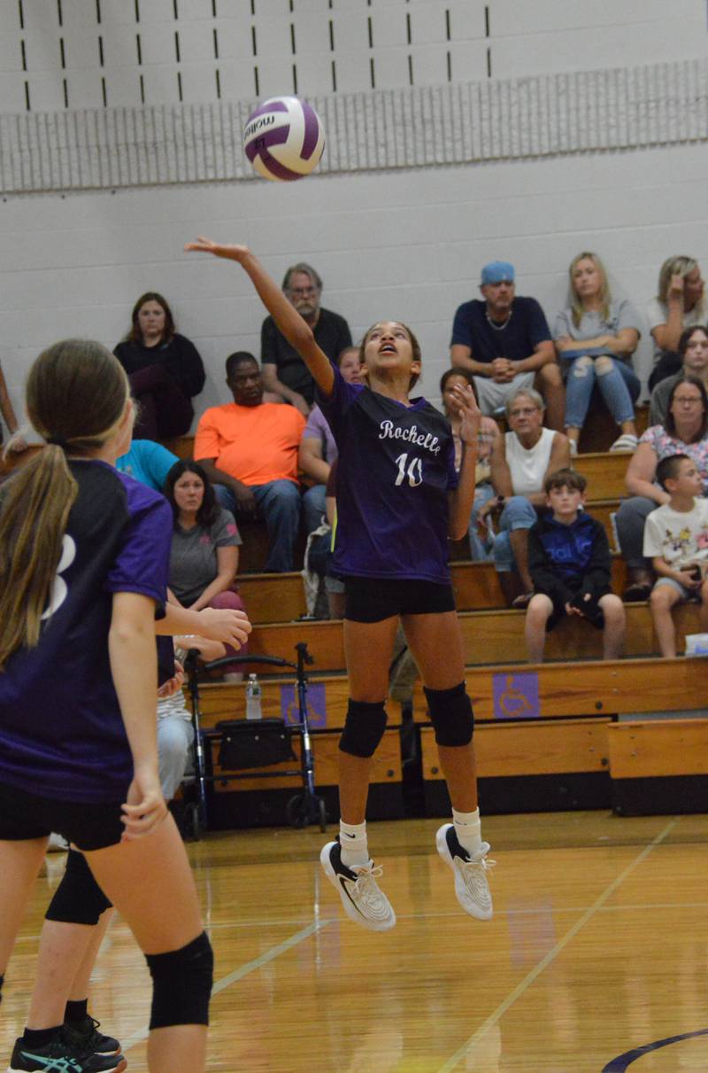 Rochelle's Annalyce Harris (10) spikes the ball during a middle school volleyball match with Prairie Knolls.
