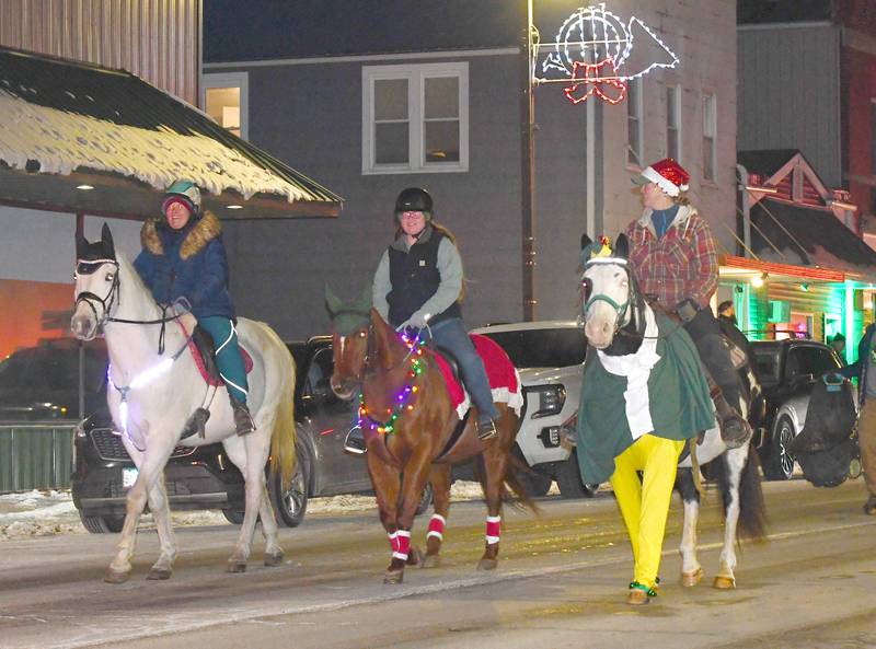 Centennial Farm horses and their riders were one of the entries in Forreston's Christmas in the Country lighted parade on Friday, Dec. 5, 2025.