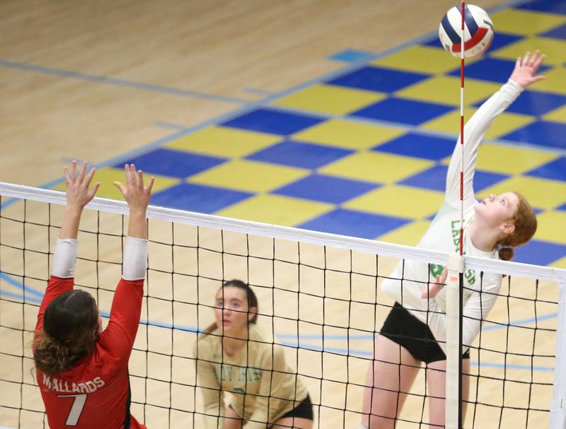 Seneca's Brooklyn Sheedy spikes the ball past Henry-Senachwine's Lauren Harbison during the Tri-County Conference Championship game on Thursday, Oct. 17, 2024 in Bader Gym at Marquette High School.