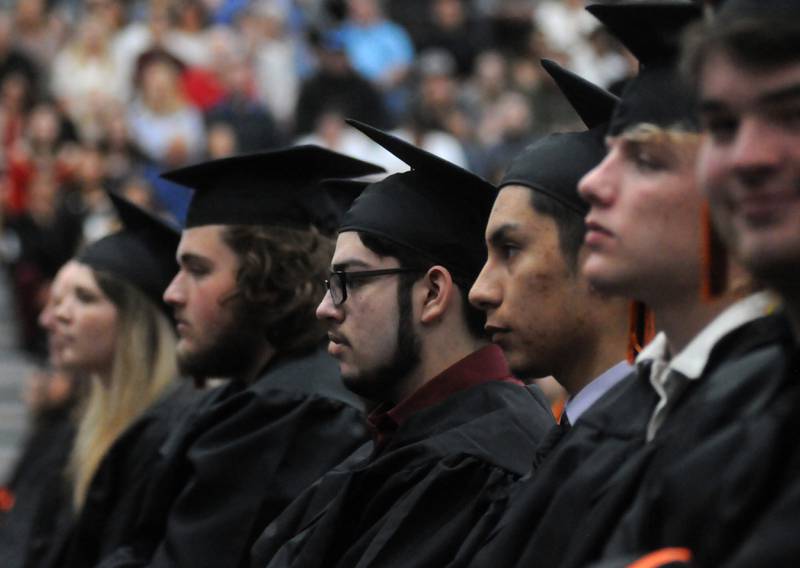 Graduates listen to Audrey Whitman speak Saturday, May 21, 2022, during the McHenry High School’s 102nd Commencement Ceremony in the gym of the school’s Upper Campus. The ceremony was moved inside and split into two ceremonies because of the rainy weather.