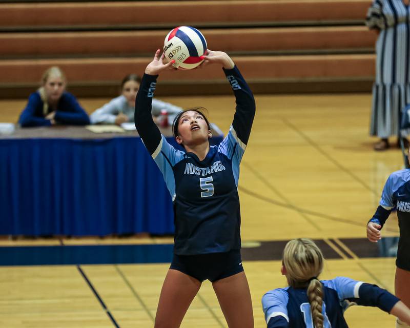 Downers Grove South's Alex Barenas (5) sets a shot during volleyball match between Downers Grove North at Downers Grove South.  Sept 7, 2023.
