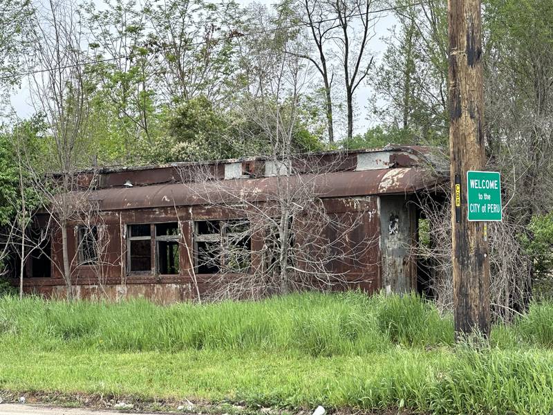 An old Rock Island Railroad car can be seen on Water Street behind Westclox on Monday, May 8, 2023 at the city limit sign in Peru.