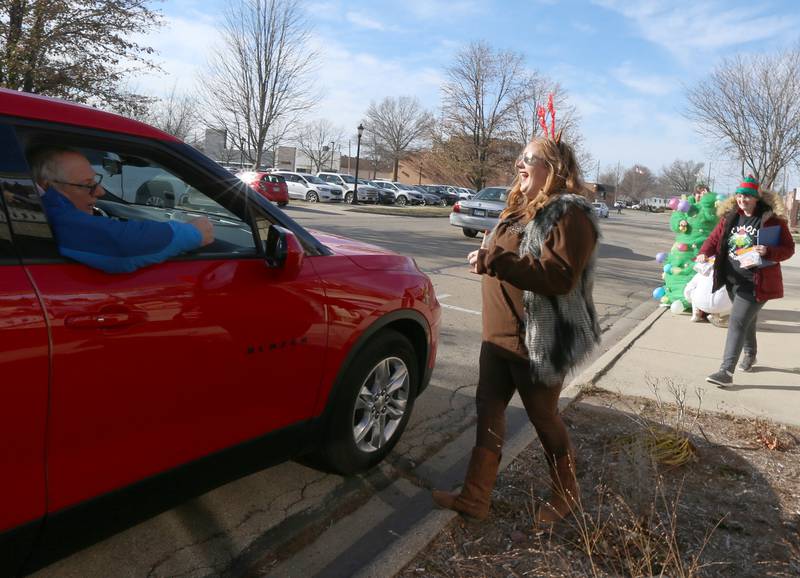 Alexis Ferracuti collects monetary donations during the 14th annual 'Freezin For a Reason' event on Friday, Dec. 2, 2022 in Ottawa.