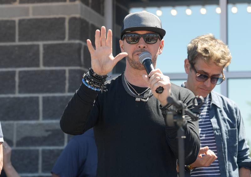 Donnie Wahlberg speaks to the fans gathered outside Wahlburgers restaurant for the Wahlk of Fame Ceremony for New Kids on the Block in St. Charles on Saturday, June 18, 2022.
