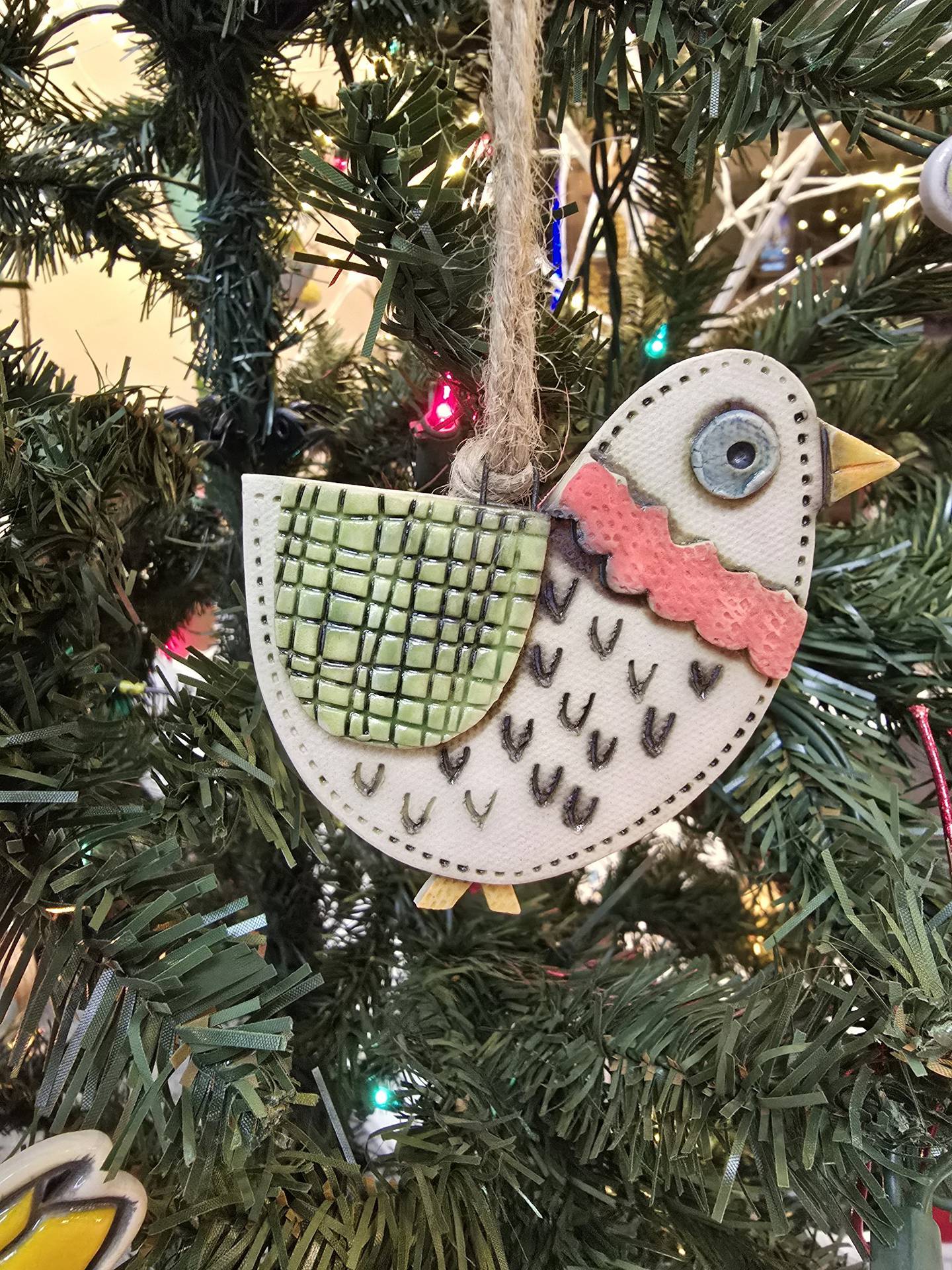Janell Mayer has handcrafted ornaments and some holiday "uggles" for sale at the Artisans on Main in Woodstock.