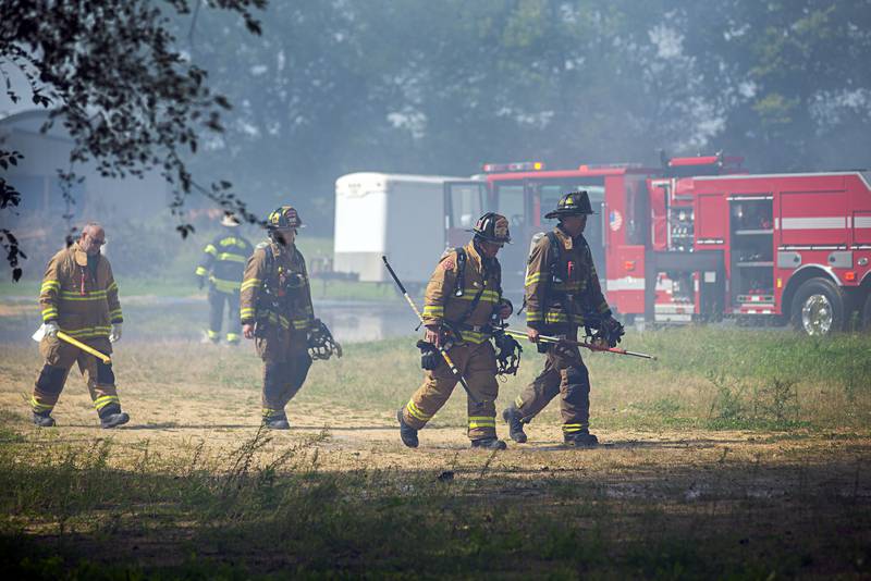 Firefighters work at the scene of a fire at 300 block of Cropsey avenue in Dixon on Monday, Sept. 26, 2022.