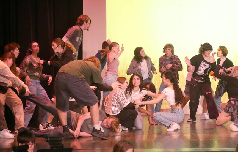Members of the cast of "Mean Girls-High School Version act out a scene out a scene during a rehearsal on Monday, March 10, 2025 in Matthiessen Auditorium at La Salle-Peru Township High School.