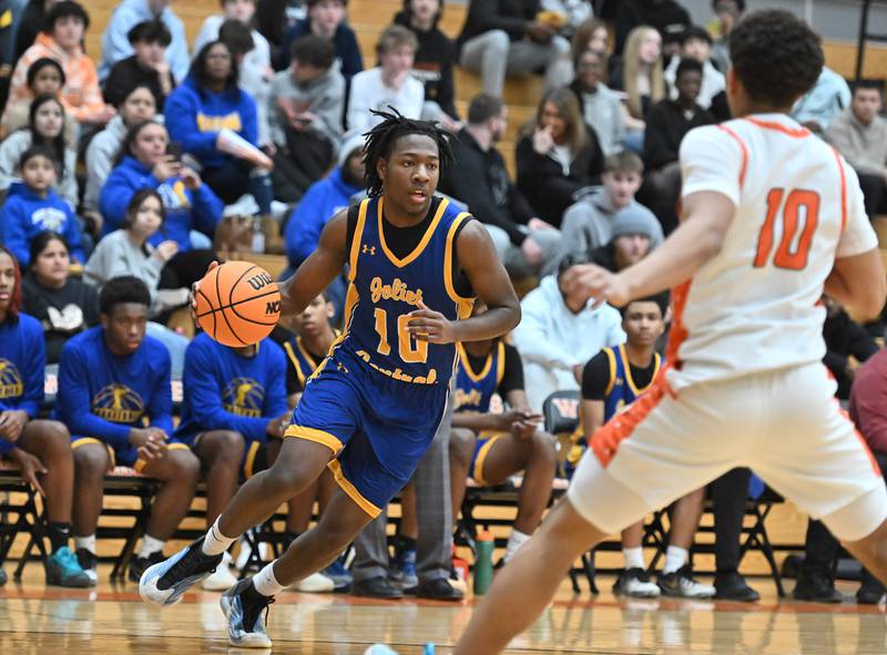 Joliet Central's James Lee (10) drives to the basket during the 4A Lockport Regional game against Lincoln-Way West on Monday, FEB. 23, 2026, at New Lenox.