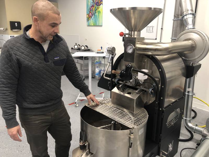 Kevin Fogelsong of Heady Cup Coffee Roasters shows off their large coffee roaster their roasting location in McHenry on Tuesday, Feb. 21, 2023.