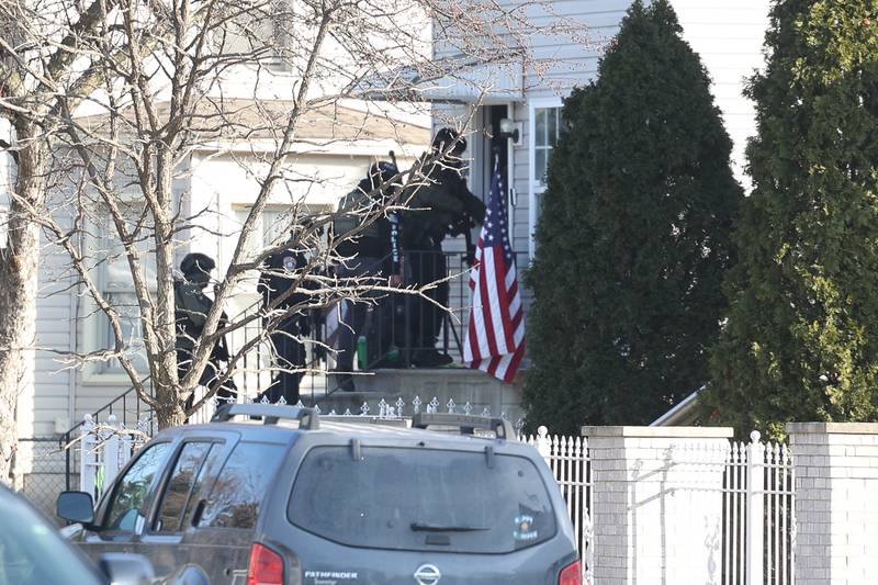 Joliet police enter a home along the 500 block of Irving Street during a standoff on Thursday, Jan. 9, 2025 in Joliet.