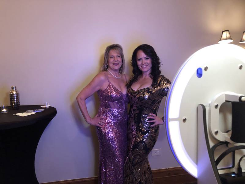 Rita McDade and Brandy Benyo take a photo at the photo booth during the Cary-Grove Area Chamber of Commerce 60th Anniversary Celebration dinner April 12, 2024.