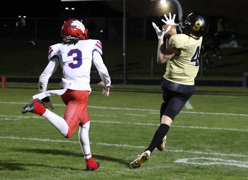 Sycamore's Aidan Wyzard gets behind Cahokia's Donald Collier for the first of his two touchdown receptions during their game Friday, Oct. 25, 2024, at Sycamore High School.
