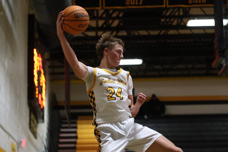Joliet West’s Ryan Lipke tries to keep possession against Plainfield East on Friday, Dec. 19, 2025 in Joliet.