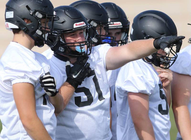 Sycamore’s Gable Carrick talks to a teammate during practice Monday, Aug. 7, 2023, at Sycamore High School.