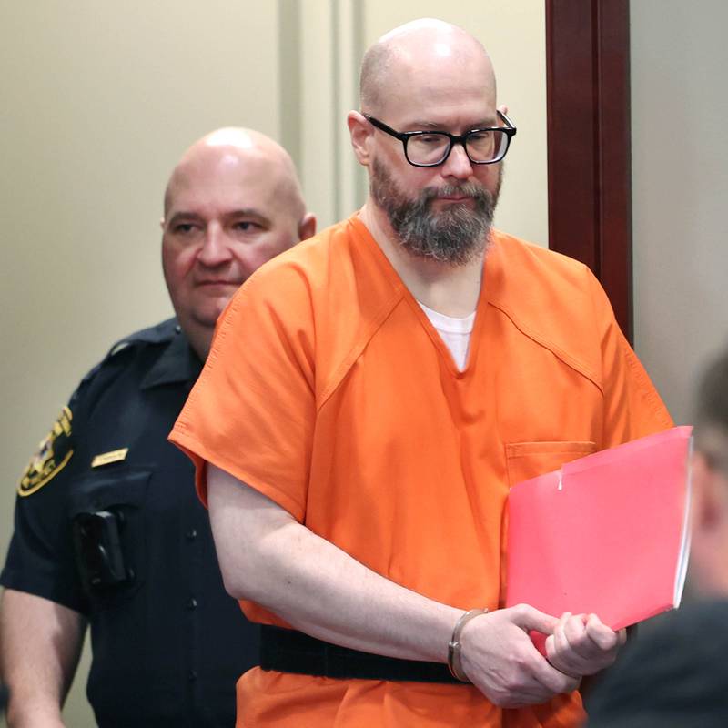 Jonathan Hurst is escorted by a DeKalb County Sheriff’s Deputy into Judge Marcy Buick’s courtroom at the DeKalb County Courthouse in Sycamore Monday, April 29, 2024 for a hearing on his case. Hurst is charged with murder in the August 2016 slayings of mother and son, Patricia A. Wilson, 85 and Robert J. Wilson, 64, of Sycamore.