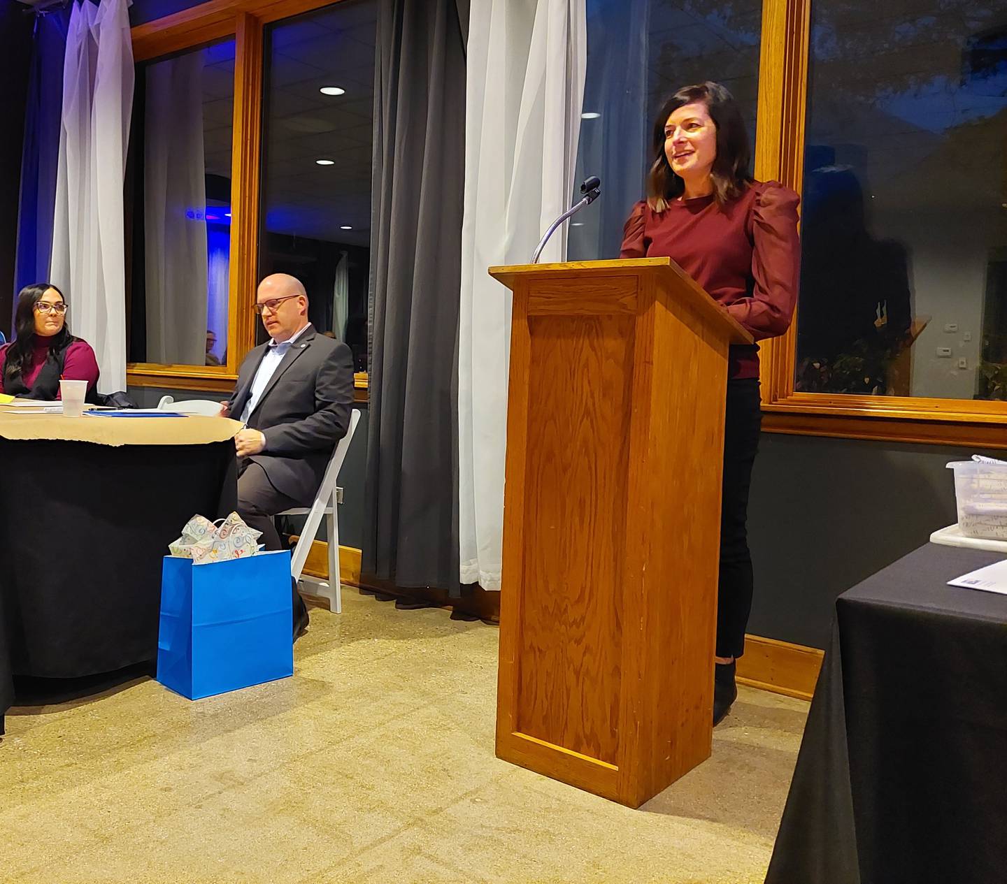 Streator United Way Campaign Chairperson Courtney Levy speaks Thursday, Nov. 2, 2023, at the agency's appreciation dinner as (from left) Vice President Theresa Solon-Wargo and President Ben Hiltabrand listen.