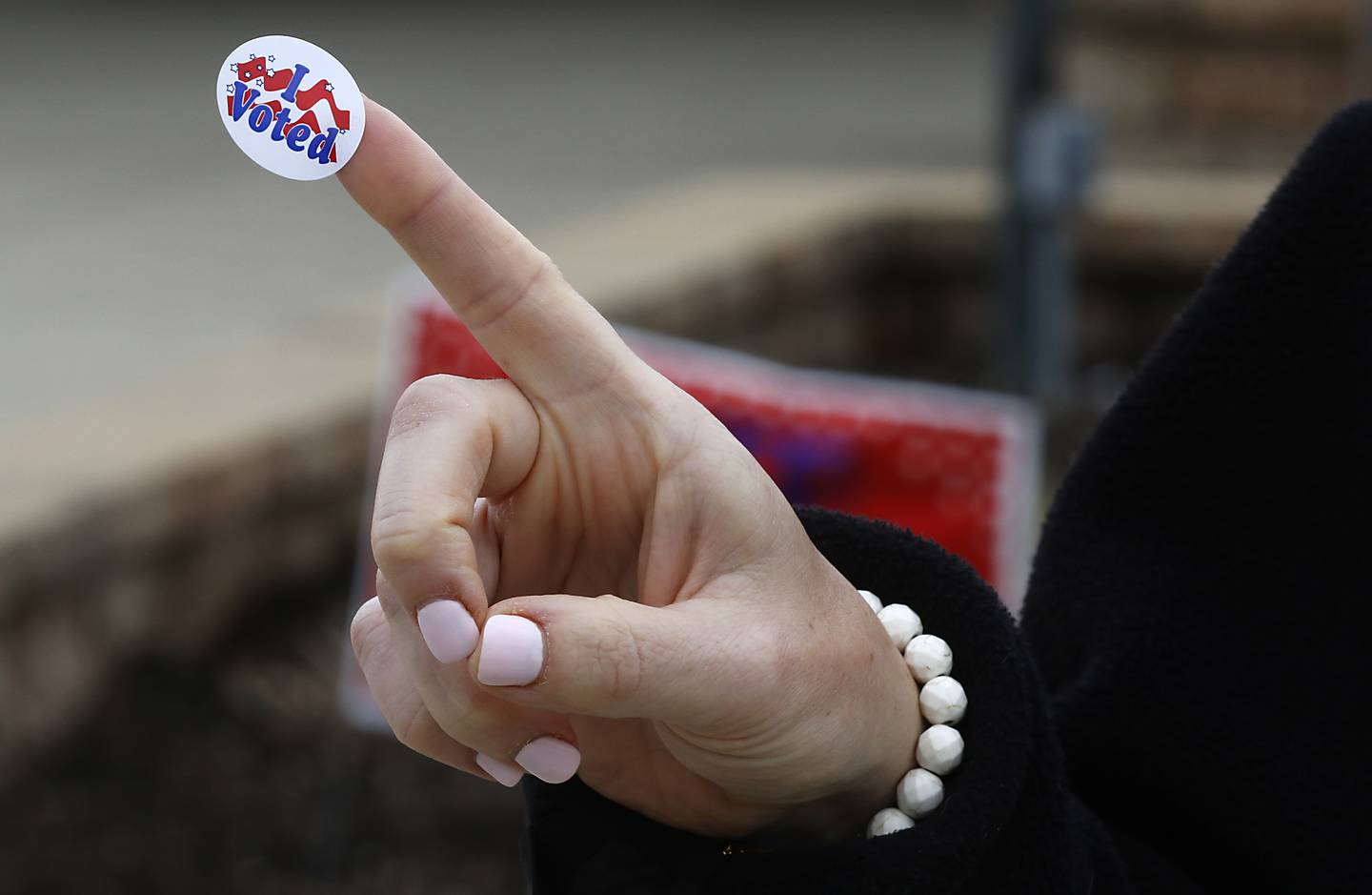 Gina Bodam of Johnsburg shows her “I Voted” after voting at the McHenry Township Office in Johnsburg on Monday, April 3, 2023, in the 2023 consolidated election.