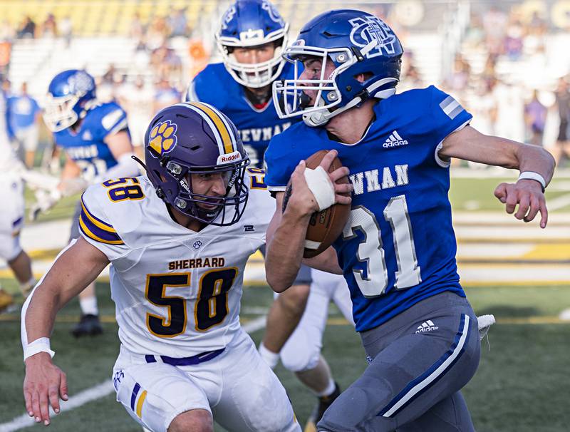 Newman’s Cody McBride runs back an interception against Sherrard Saturday, Sept. 2, 2023 in a game at Sterling High School.