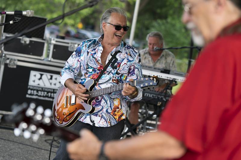 John Todd and the John Todd Band perform during the first night of the 10th annual Blues, Brews & BBQ on Friday, August 20 at Petersen Park in McHenry. The event, which runs through Sunday, featured live music, barbecue and drinks. Ryan Rayburn for Shaw Local