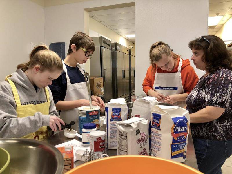Grundy County students bake dozens of cookies for housing authority