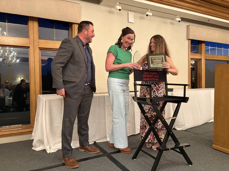 McHenry County Educator of the Year winner Dawn Wiginton is presented with a director's chair at the McHenry County Educator of the Year ceremony in Lake in the Hills, Saturday, May 9, 2026.