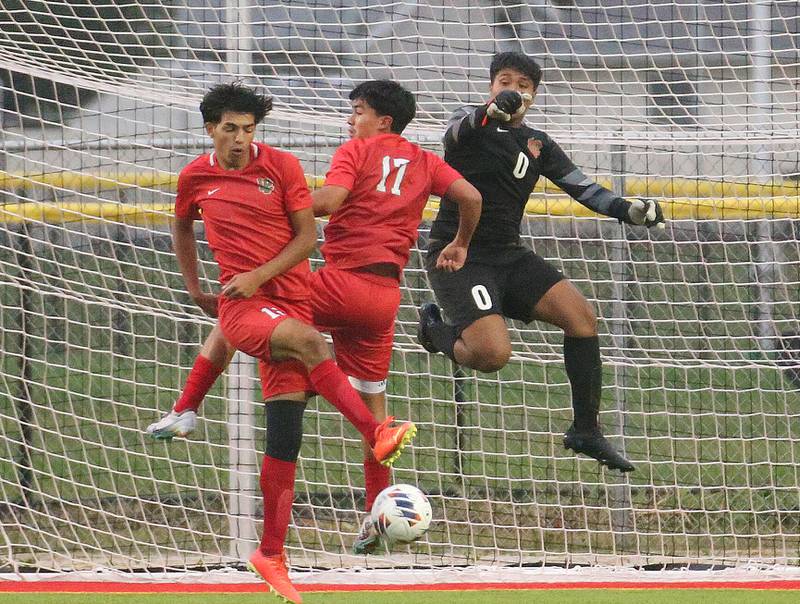 L-P's Rylee Hernandez, Ismael JMejia and keeper Abraham Garcia stop a kick in the box from Ottawa on Monday, Sept. 11, 2023 at the L-P Athletic Complex in La Salle.