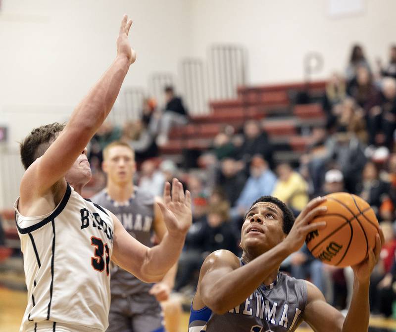 Newman’s Tyson Williams looks to put up a shot against Byron’s Caden Considine Friday, Dec. 19, 2025, in the Forreston Holiday Tournament title game.