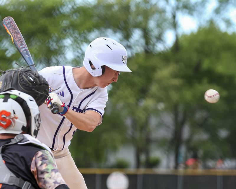 Plano's Jake Decker (2) reacts after getting hit by a pitch during baseball game between Sandwich at Plano.  May 8, 2024