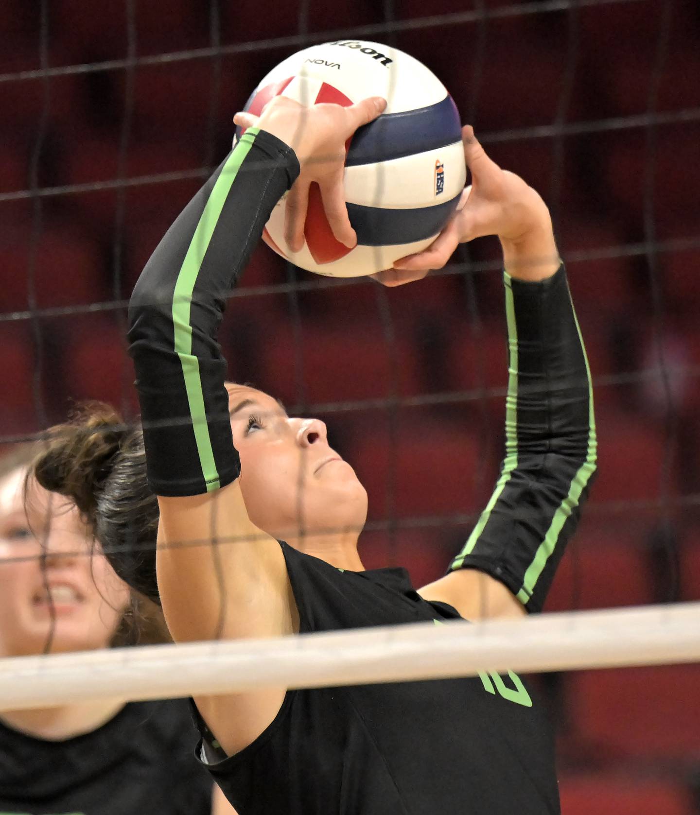 Providence Catholic’s Delaney Purtill sets the ball against Prairie Ridge in the Class 3A third place match at the IHSA girls volleyball state finals tournament on at Illinois State University on Saturday, Nov. 15, 2025
