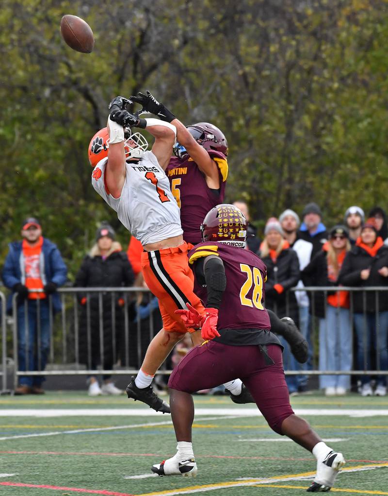 Montini's Max Bell breaks up a pass inended for Byron's Brayden Knoll (1) during a Class 3A second-round game on November 9, 2024 at Montini Catholic High School in Lombard.