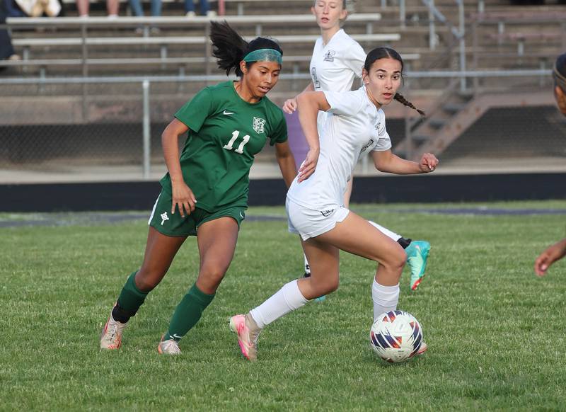 Kaneland's Taylor Mills (right) and Boylan's MaryTherese Harrison go after the ball Wednesday, May 28, 2025, during their Class 2A sectional semifinal game at Belvidere High School.