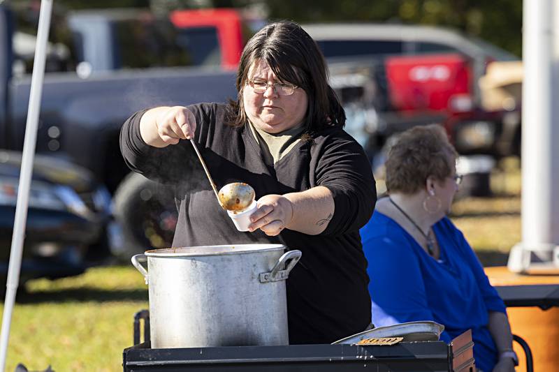 Kim Moore dishes up chili Sunday, Oct. 22, 2023 at the Elks Club chili cookoff. Moore, part of the “Two Old Ladies and a Pot” duo, cooks with teammate Raeann Henry.
