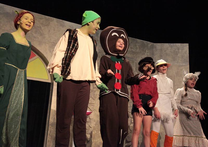 Emily Wendt as Fiona (left), John Cocar as Shrek (second from left), along with other favorite storybook characters, took the stage to perform DreamWorks’ “Shrek the Musical Jr.” at Dixon High School’s James A. Wiltz Auditorium in January. The show was a Woodlawn Arts Academy and Dixon Public Schools production.