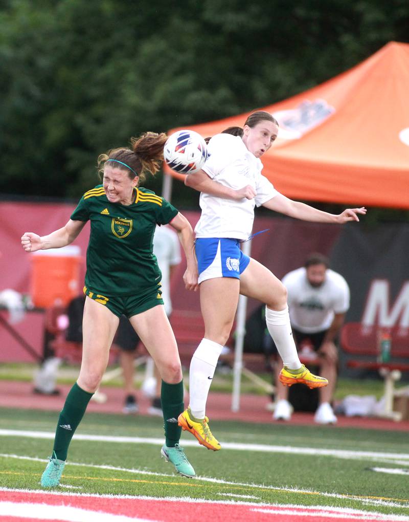 Fremd’s Maddie McMillan (left) and St. Charles North’s Rian Spaulding head the ball during the Class 3A state semifinal game at North Central College in Naperville on Friday, May 31, 2024.