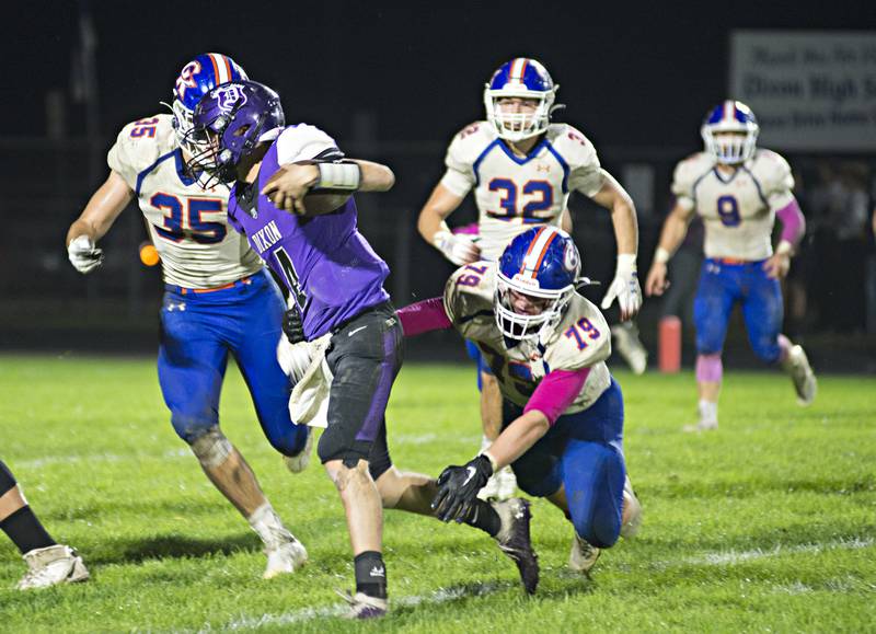Dixon's Tyler Shaner looks to break a tackle Friday, Oct. 8, 2021 against Genoa-Kingston.