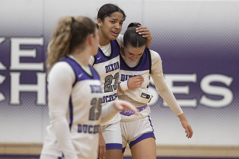 Dixon’s Ahmyrie McGowan hugs Kiley Gaither after the Duchesses loss to Geneva Thursday, Feb. 19, 2026, in the Class 3A girls basketball regional title game.