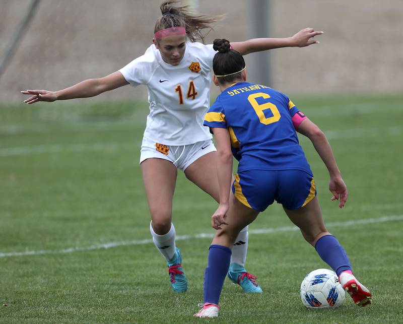 Richmond-Burton's Addison Sell tries to slow down the attack of Johnsburg's Liz Smith during the Kishwaukee River Conference Girls Soccer Tournament Championship match on Wednesday, May 6, 2026, at Johnsburg High School.