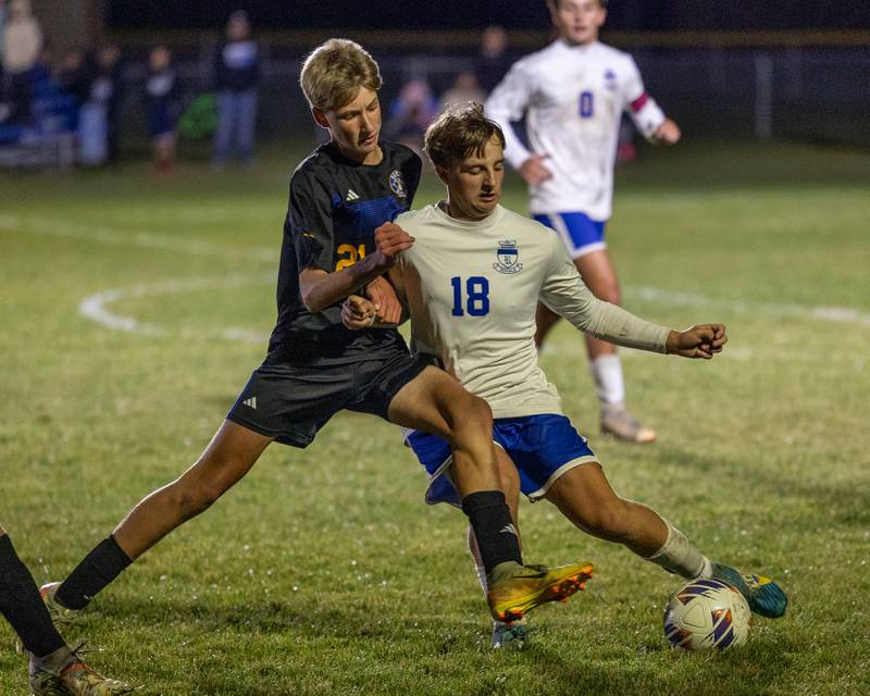 Carson Harper (21) of Somonauk/Leland/Newark pushes away Colten Sargent (18) of Hinckley-Big Rock as they fight over possession of ball during the Little Ten Conference Championship match on Thursday, Oct. 9, 2025 at Hinckley-Big Rock School in Hinckley.