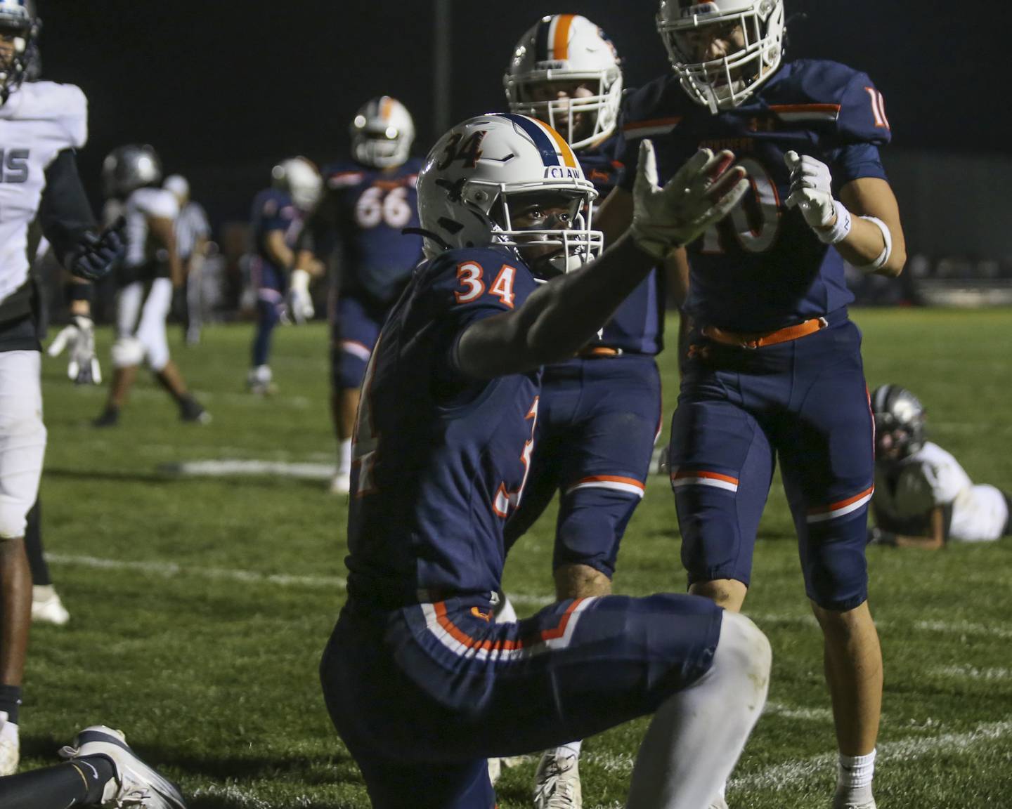 Oswego's Ammar Banire (34) reacts after scoring his first touchdown during football game between Oswego East at Oswego Friday, Oct 17, 2025 in Oswego.