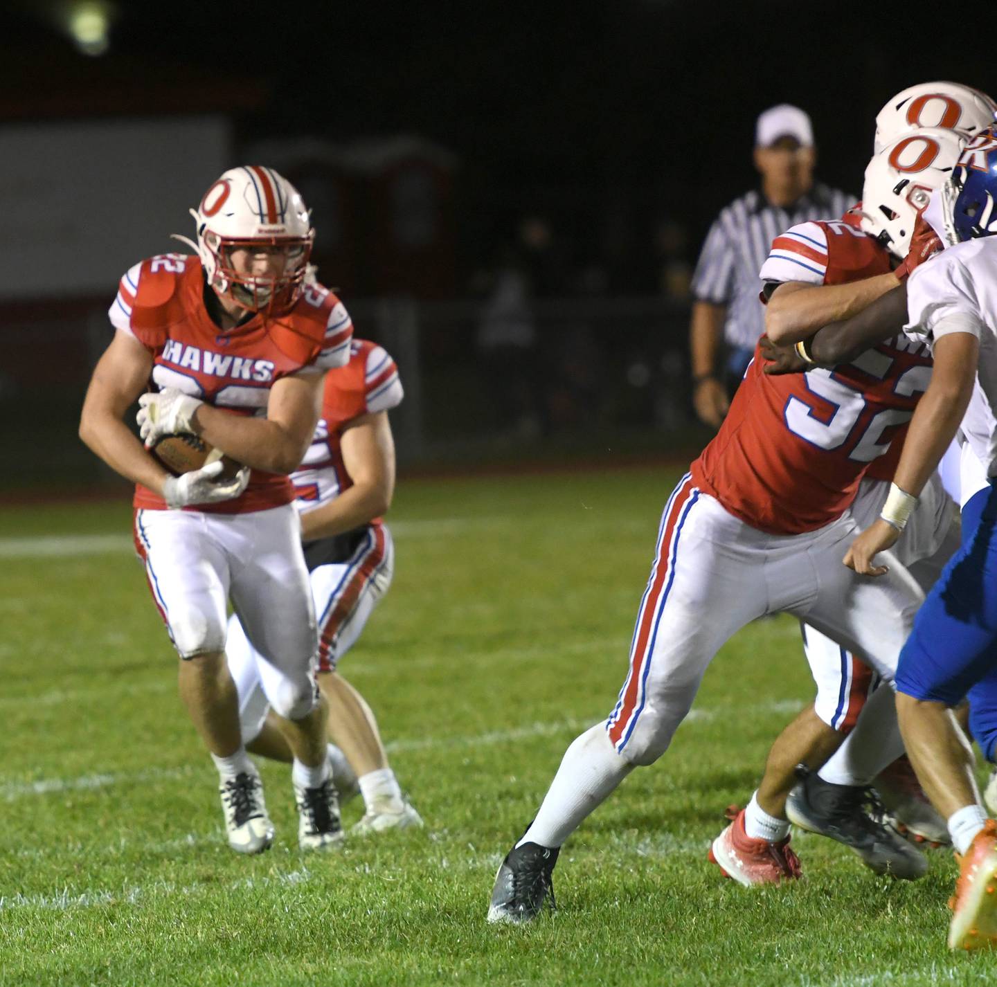 Oregon's Gabe Eckerd looks for a gap in the line during action against Genoa-Kingston at Landers-Loomis Field on Friday, Sept. 30.