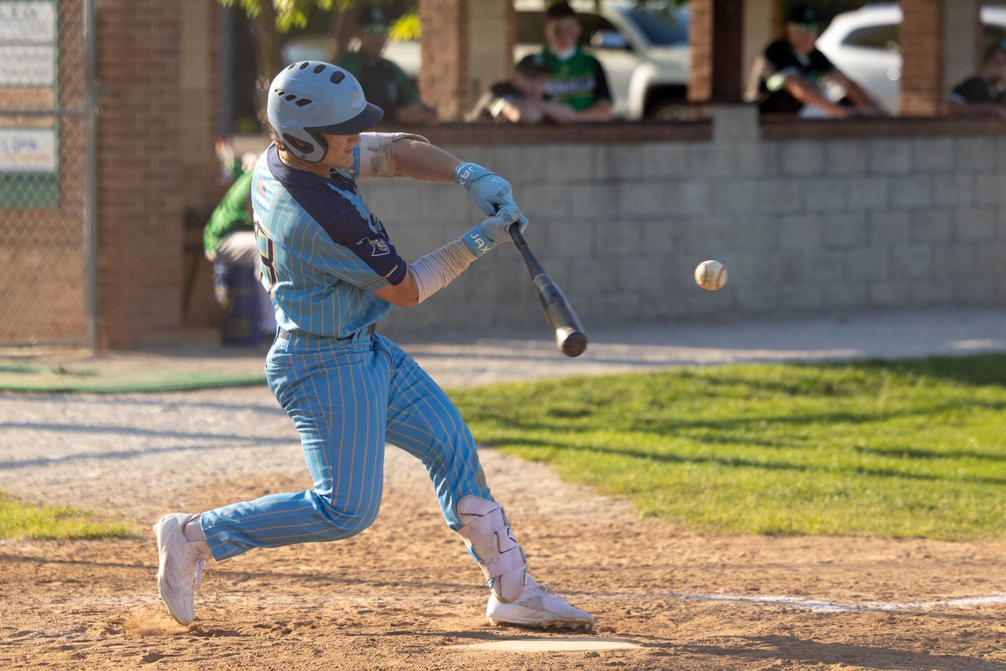 Grant Dose (23) of Marquette hits ball on Thursday, May 8, 2025 at Masinelli Field in Ottawa.