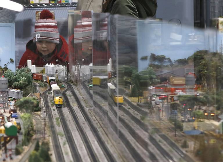 A boy looks at a model trains on Saturday, Jan. 21, 2023, at the Illinois Railway Museum. The museum is celebrating its 70 anniversary with the first of many celebrations by commemorating the 60 years since the abandonment of the Chicago North Shore and Milwaukee Railroad.