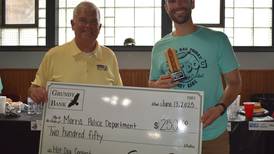 Officer Ryan Ties wins Grundy Bank hot dog eating contest