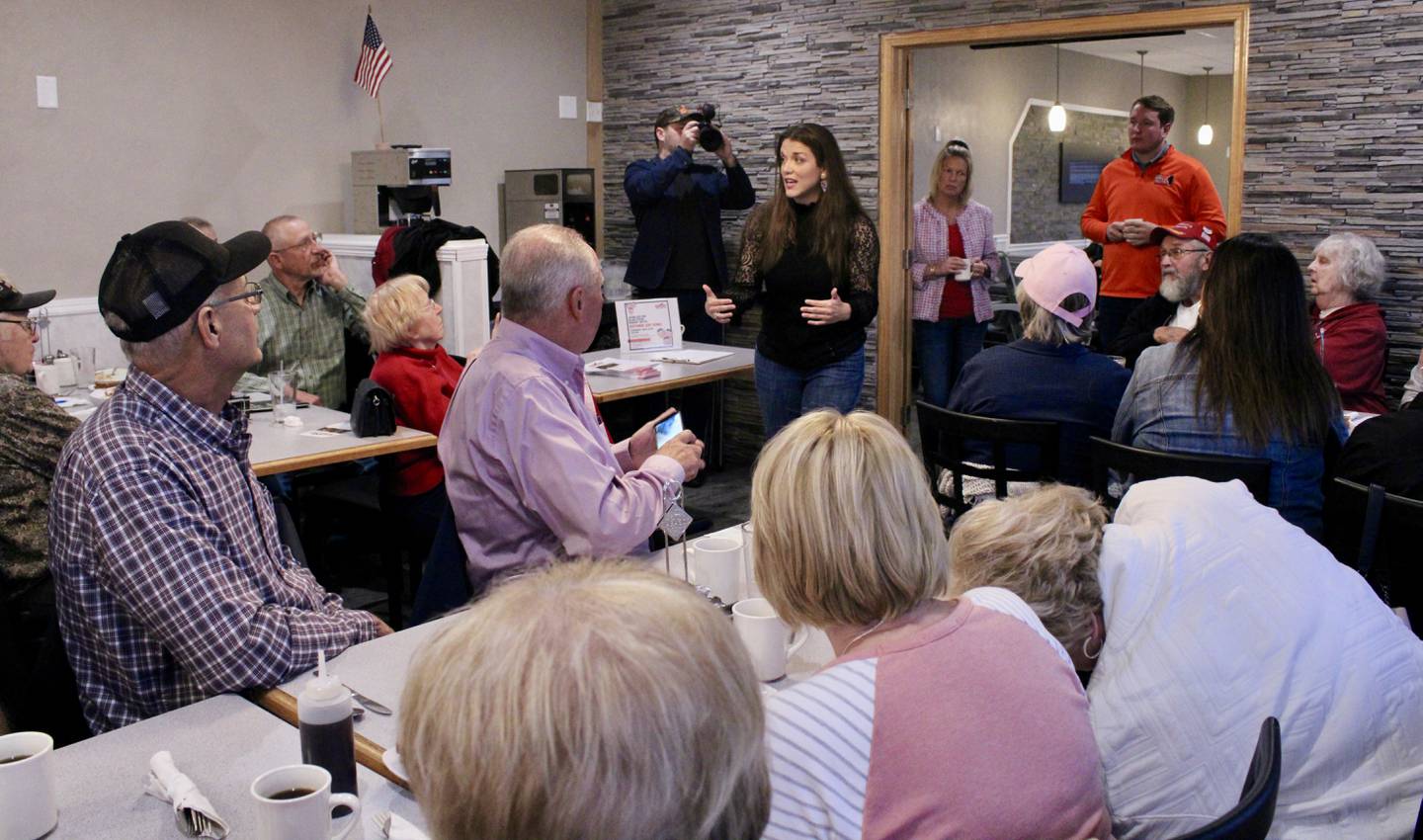 More than 50 people crowded into the A's Kitchen banquet room on Saturday morning for a meeting of the Twin City Conservatives to hear from Esther Joy King. In the doorway stand state Rep. Tony McCombie and Bradley Fritz. Both are unopposed in their respective statehouse races.