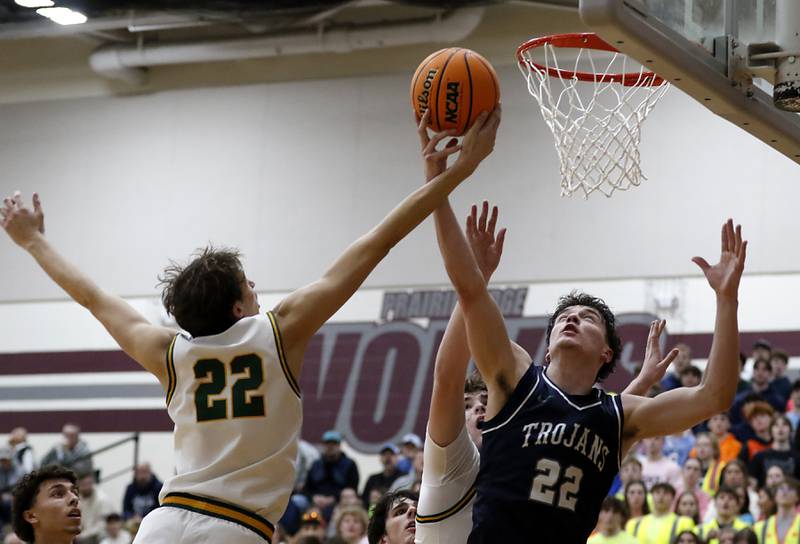 Crystal Lake South's Anthony Santarelli battles with Cary-Grove's Adam Bauer for a rebound during the IHSA Class 3A Prairie Ridge Regional championship basketball game on Friday, Feb. 28, 2025, at Prairie Ridge High School in Crystal Lake.